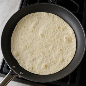 Lavash flatbread warming in a dry skillet