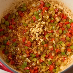 Garlic and Cajun seasoning stirred into softened vegetables