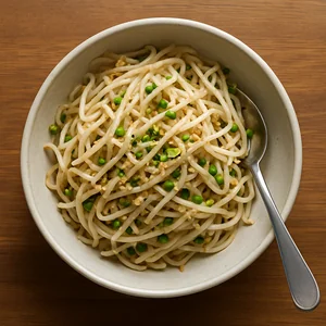 The seasoned sprouts are mixed in a bowl and look evenly coated.