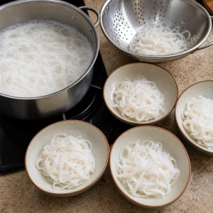 Rice noodles boiled drained and divided among pho bowls