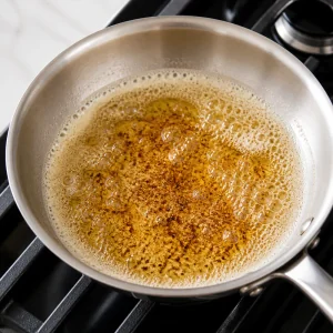 Unsalted butter browned until amber and foamy in a skillet