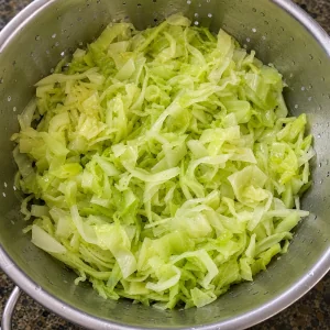 Blanched cabbage draining in a colander