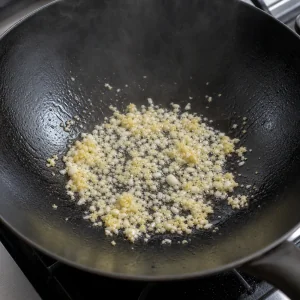 Garlic and ginger sizzling in oil