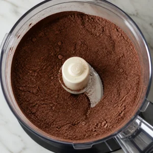 Dry cocoa wafer ingredients mixed in a food processor