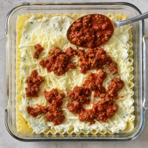 Ricotta filling mozzarella and meat sauce layered over lasagna noodles