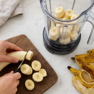 Ripe bananas sliced into rounds and placed in a blender jar