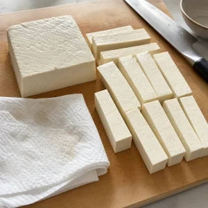Firm silken tofu cut into thick rectangles