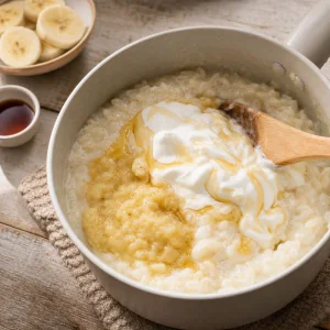 Greek yogurt and honey folded into warm rice pudding