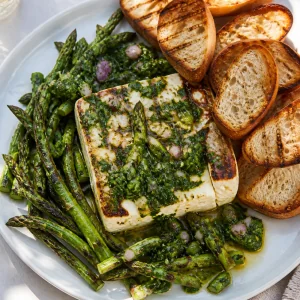 Grilled feta with asparagus chimichurri and baguette toasts