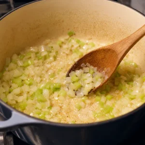 Onion and celery softening in bacon fat and butter