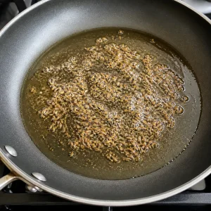 Cumin seeds sizzling in hot oil