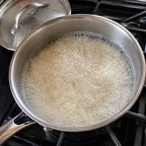 Basmati rice simmering in a saucepan