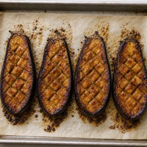 Caramelized miso glazed eggplant on a baking sheet