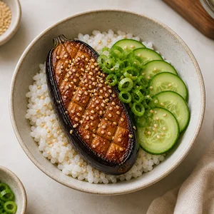 Finished miso eggplant rice bowl sprinkled with toasted sesame seeds