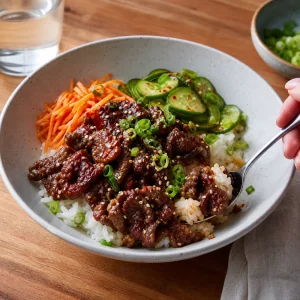 Finished Korean beef rice bowl with toppings ready to mix and serve