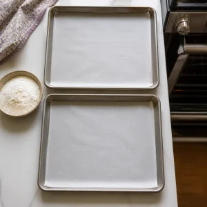 Parchment-lined baking sheets ready for cookie dough