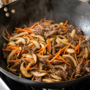 Carottes, oignons et shiitakes sautes avec du boeuf