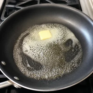 Butter foaming in a nonstick skillet