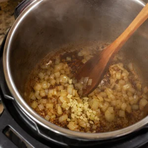 Diced onion and garlic sauteed in the pressure cooker pot