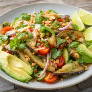 Thai smoky eggplant salad with avocado, herbs, peanuts, and lime