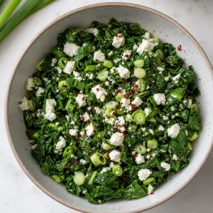 Spinach feta green onion and red pepper filling mixed in a bowl