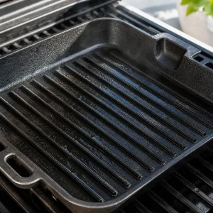 Oiled grill pan heating before the shrimp skewers are added.